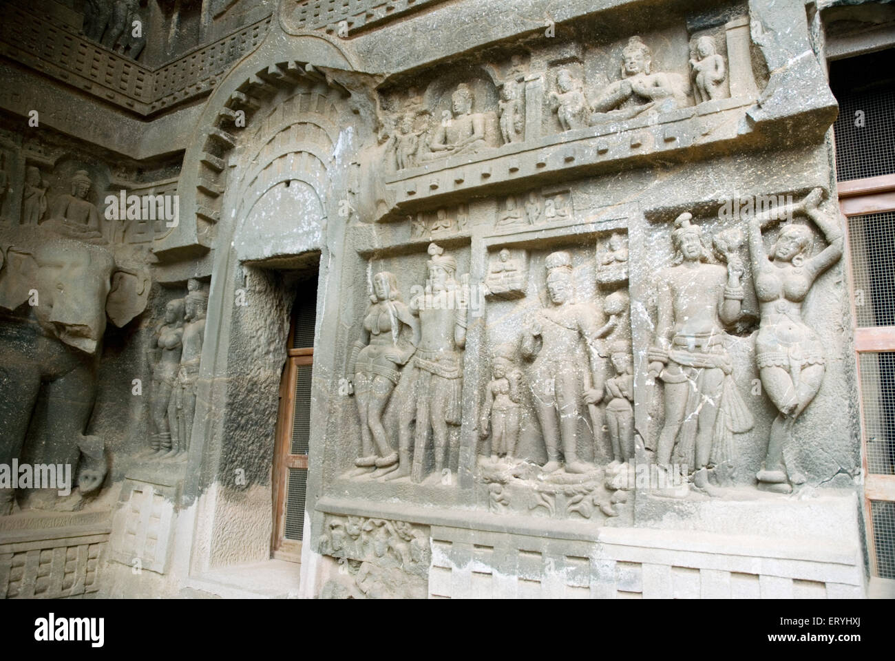 Stone carving dancing couples in Buddhist cave ; Malavali ; Karla ; Pune Poona ; Maharashtra ; India Stock Photo