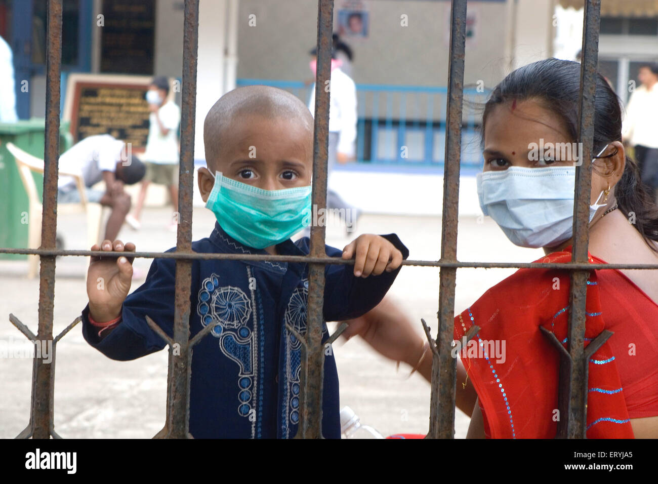 Indian mother and child wearing masks for virus protection ; Bombay ; Mumbai ; Maharashtra ; India ; Asia Stock Photo