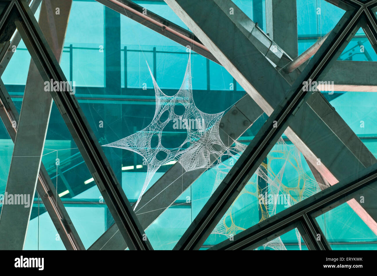 Web installation in glass window design pattern shape architecture form ; Melbourne ; Victoria ; Australia Stock Photo