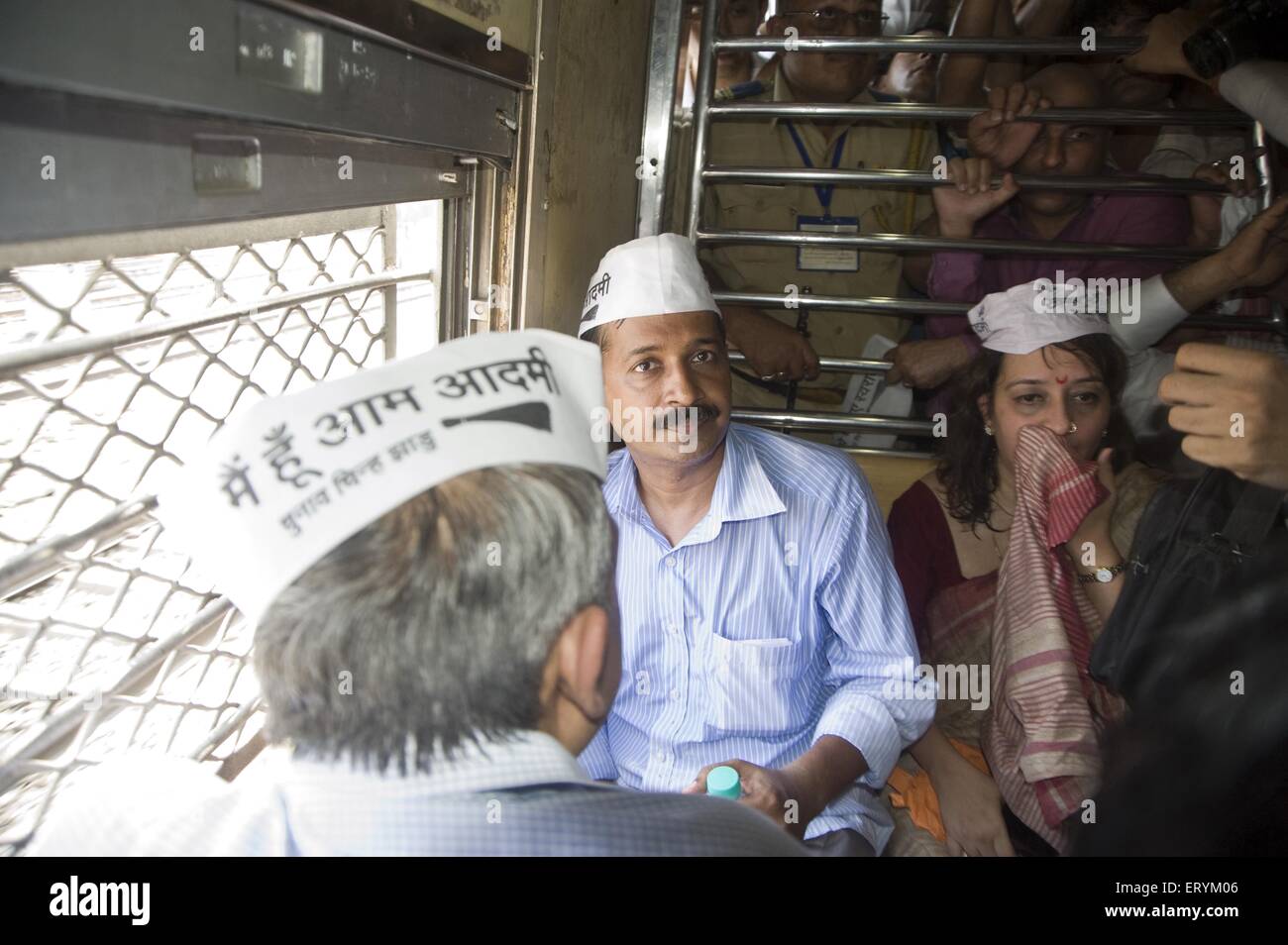 Aam Aadmi Party chief Arvind Kejriwal with Meera Sanyal in local train at mumbai Maharashtra India Asia Stock Photo