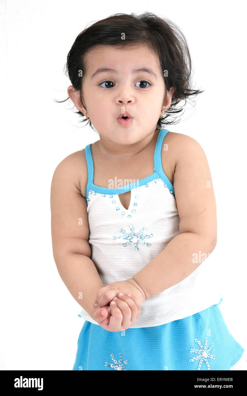 Fifteen month old baby girl standing both hands joined together MR#743S Stock Photo