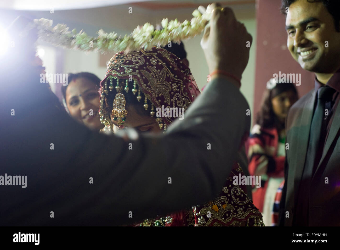 Groom and bride in wedding jaimala ritual Uttar Pradesh India Asia Stock Photo