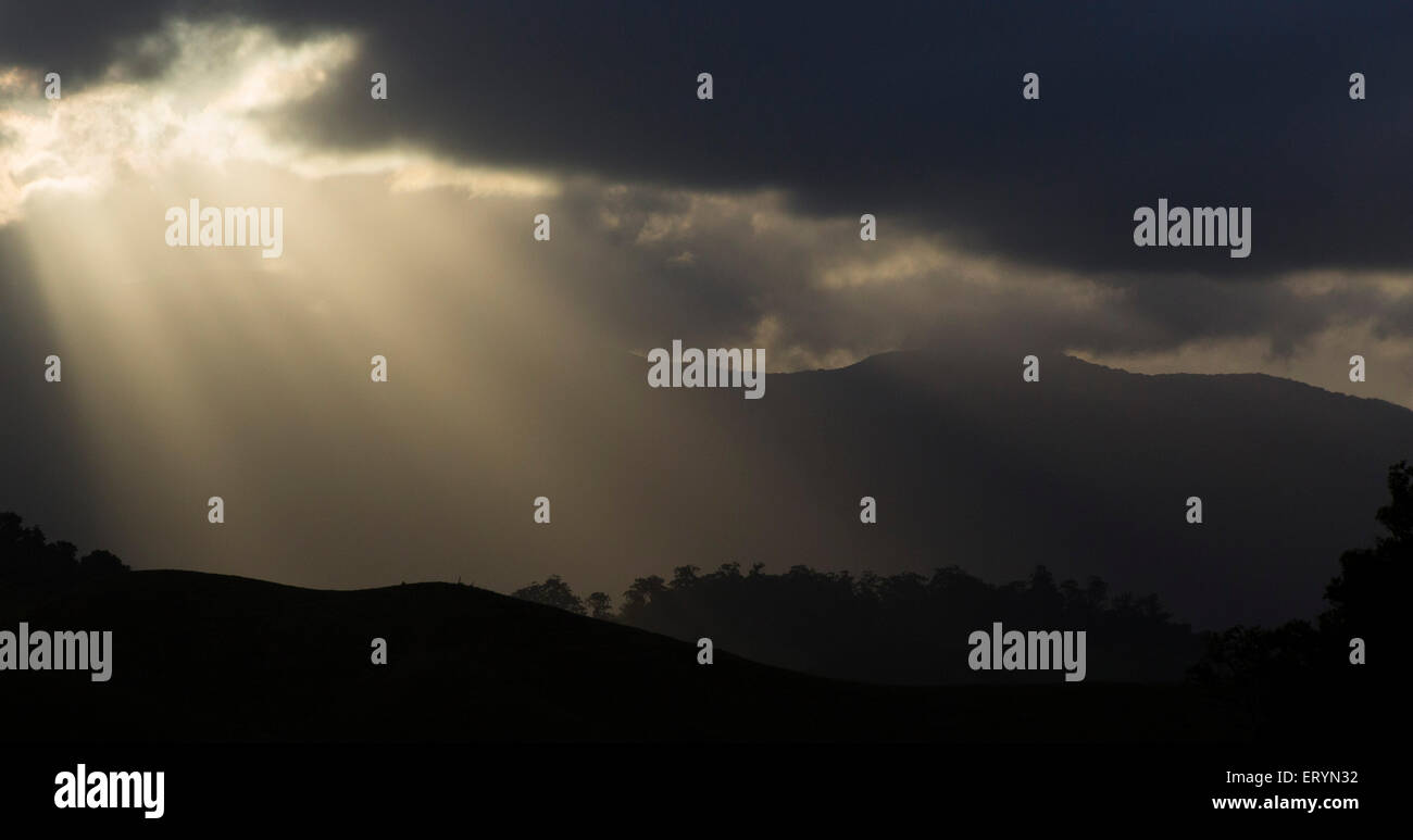 Stormy sky and burst of sun rays in the Daintree region, Queensland, Australia Stock Photo