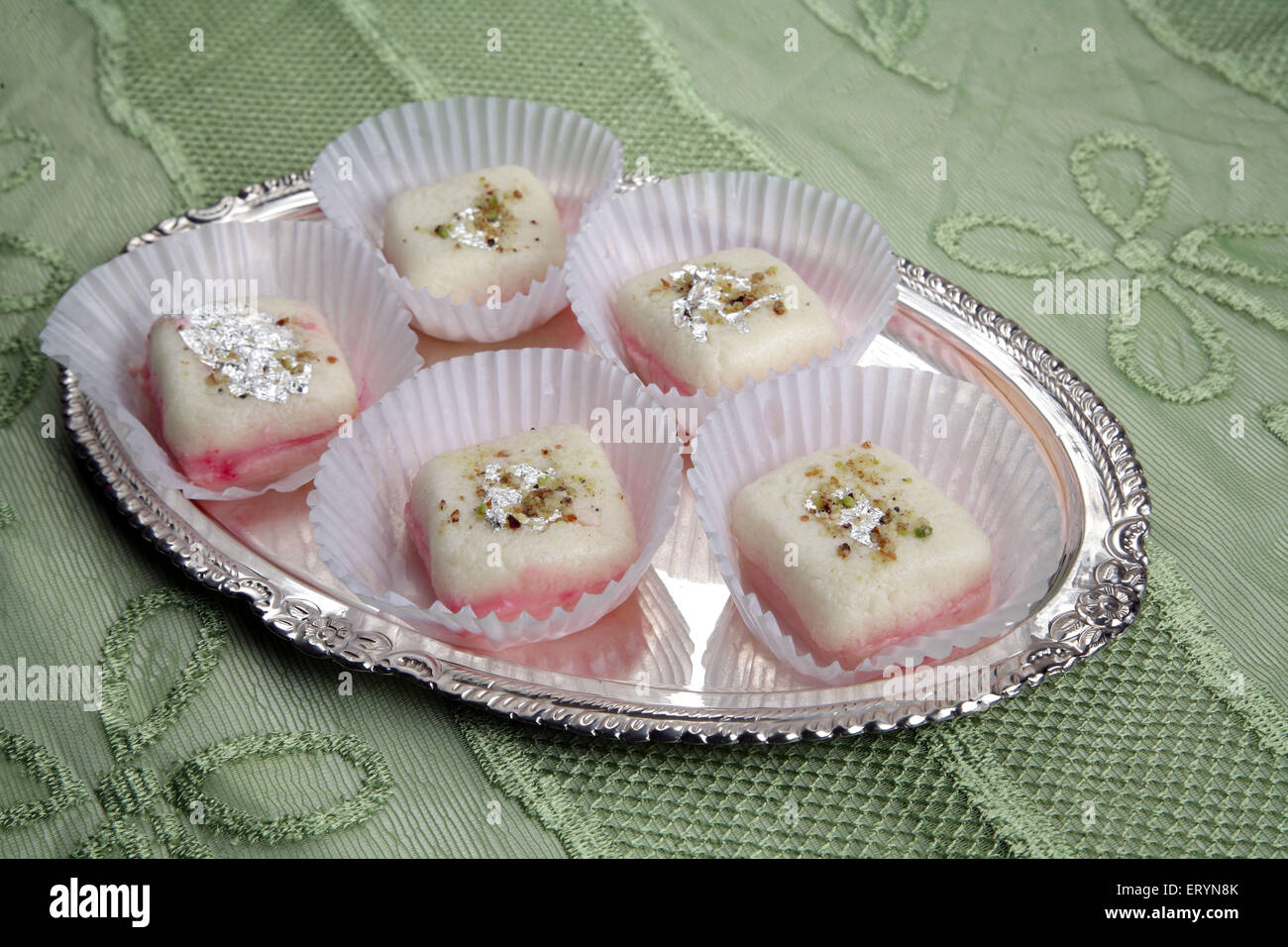 Bengali malai sandwich sweet in white paper cups on Silver plate India PR#743AH Stock Photo