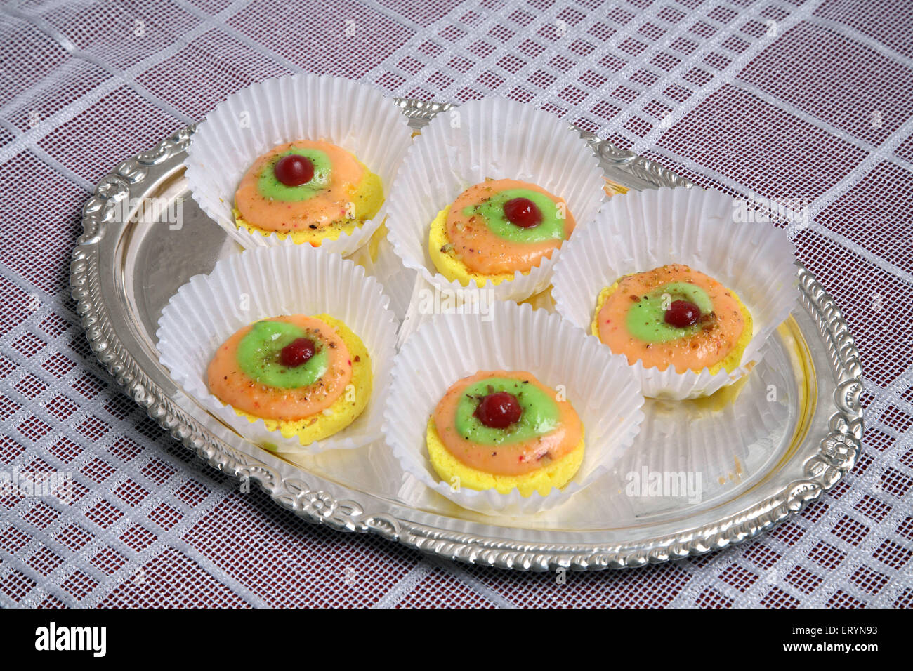 Bengali Sweet Ras Madhuri in white paper cups on Silver plate India PR#743AH Stock Photo