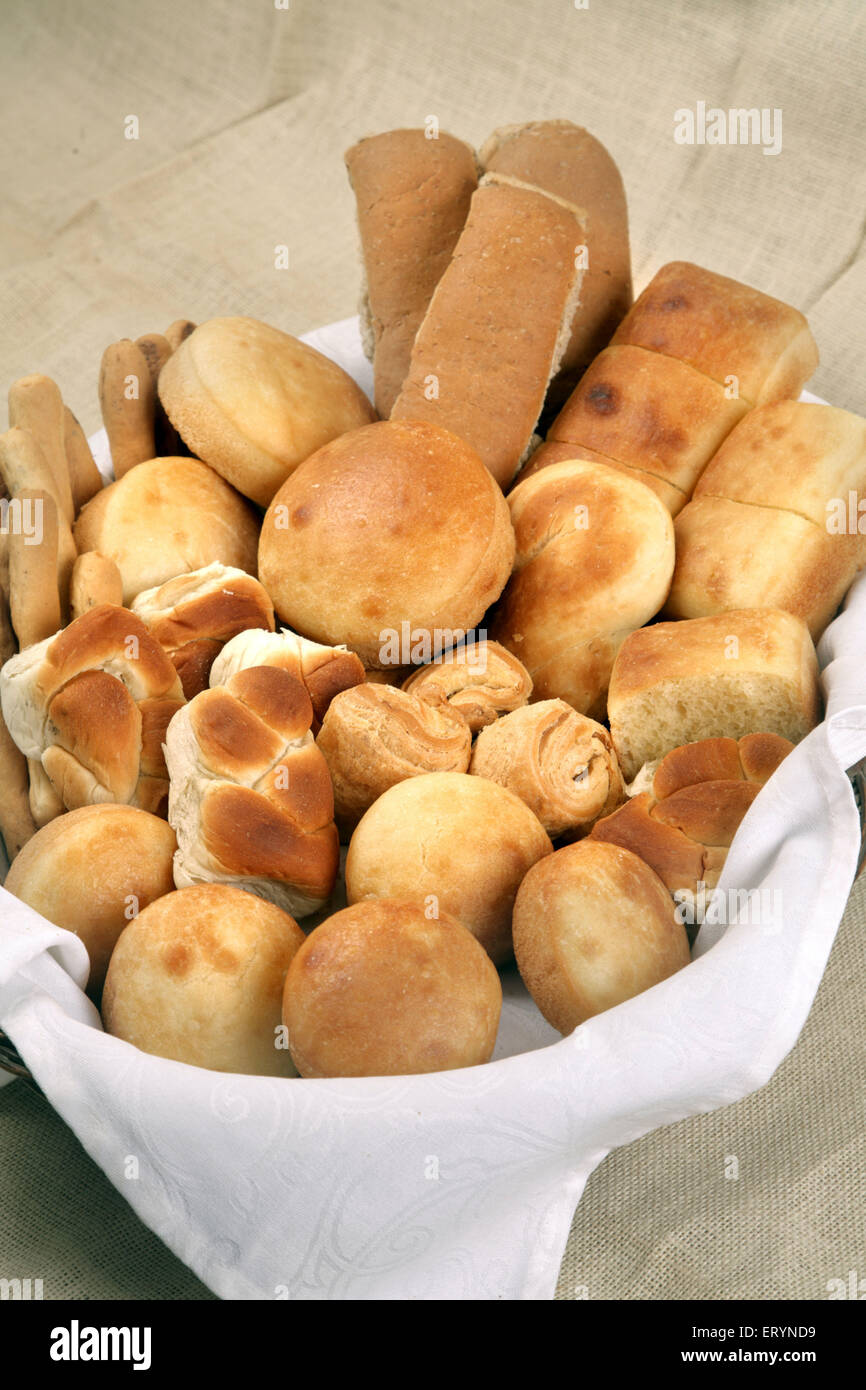 Different types of breads in cane basket India PR#743AH Stock Photo