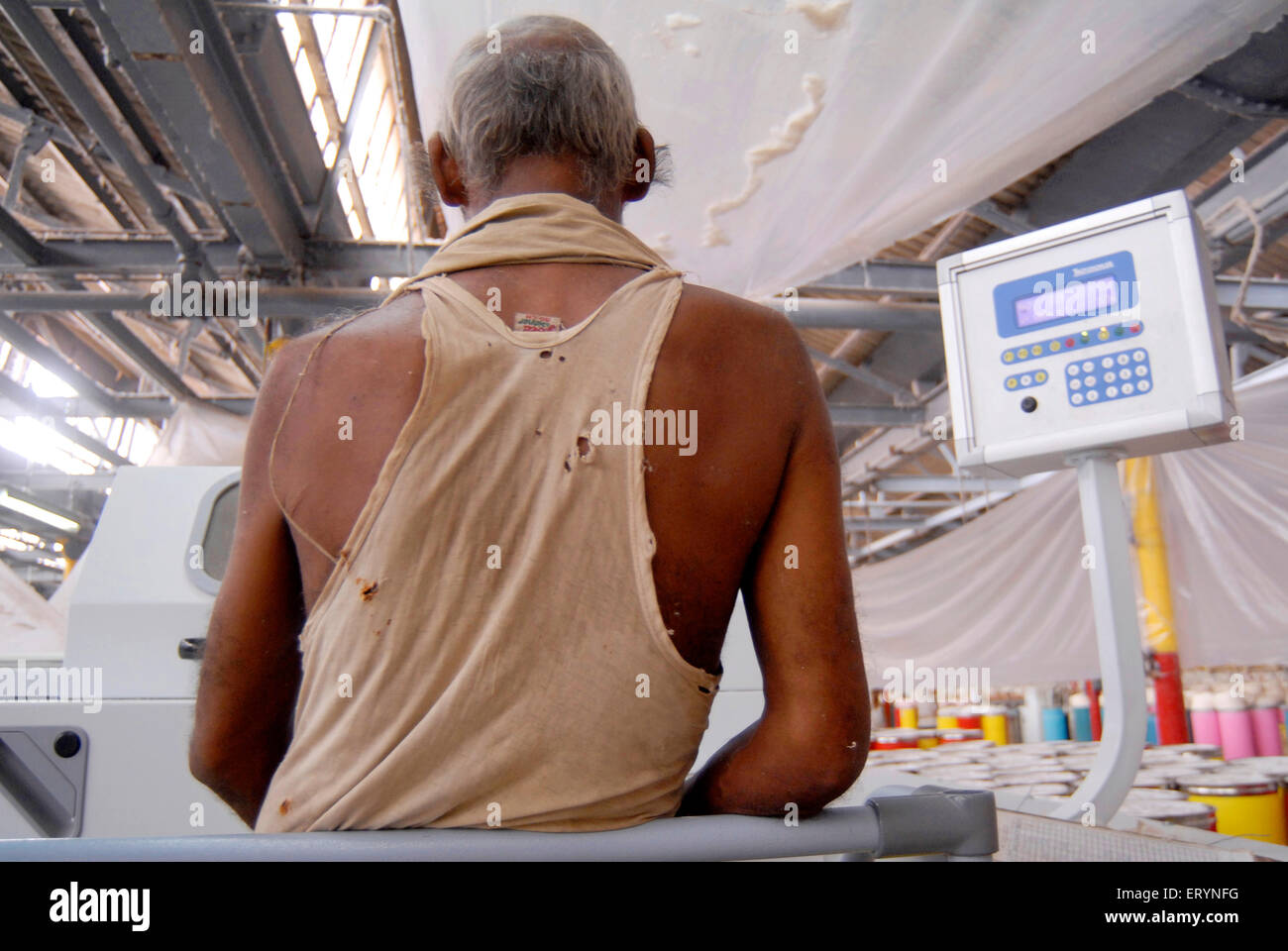 Mill workers working in textile mill ; Bombay now Mumbai ; Maharashtra ; India Stock Photo