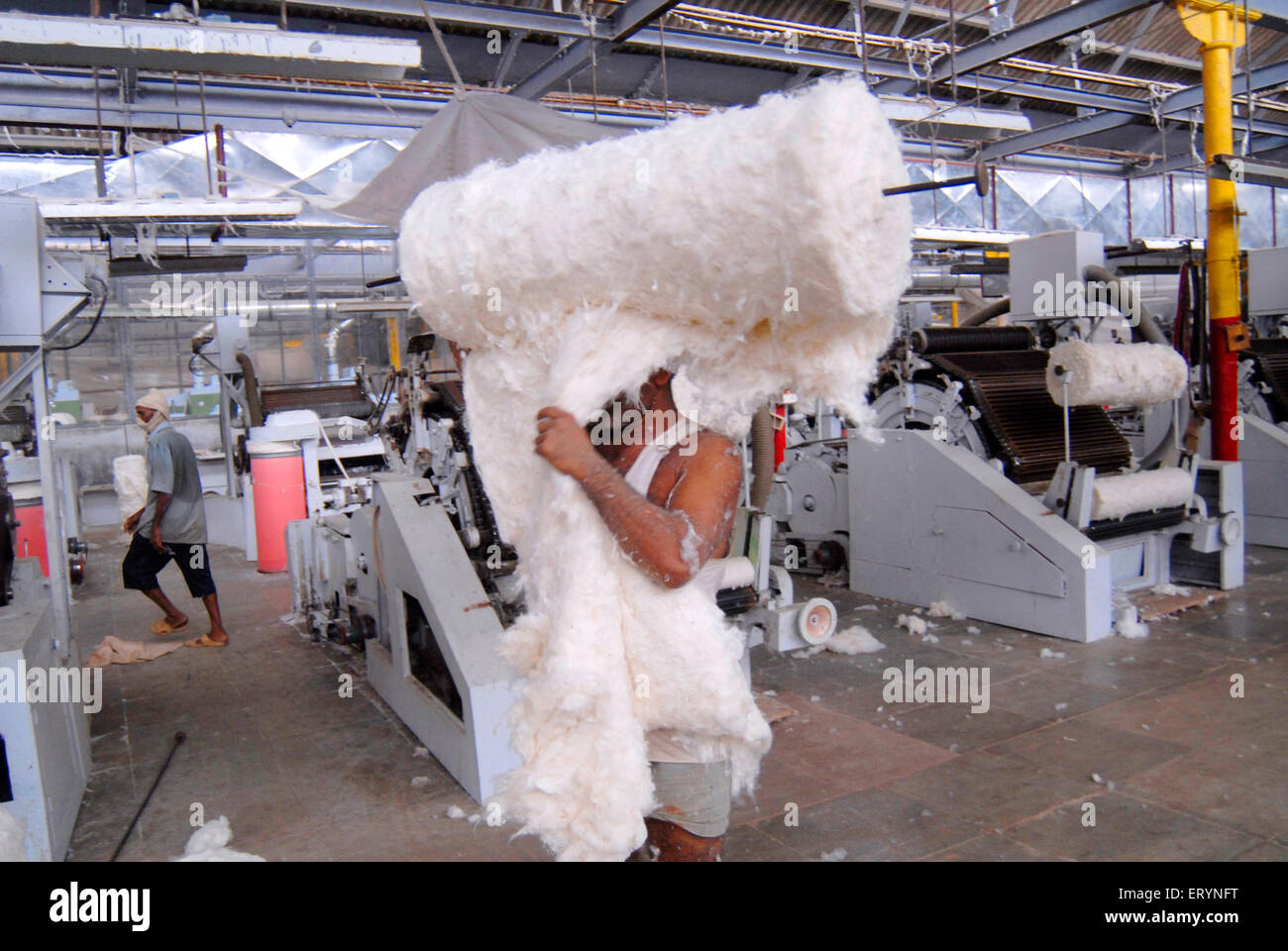 Mill workers working in textile mill ; Bombay now Mumbai ; Maharashtra ; India Stock Photo