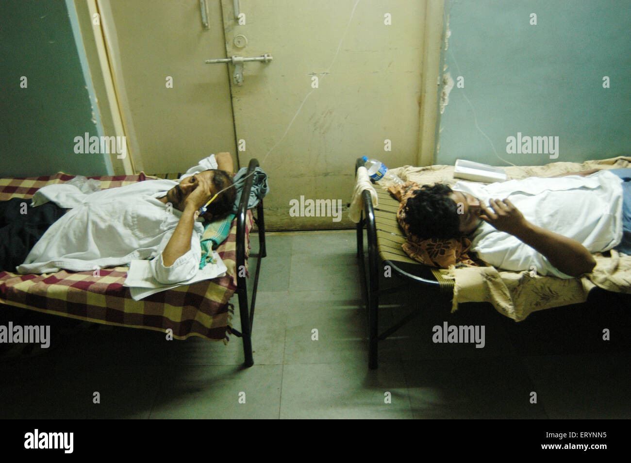 Patients being treated in the municipal hospital due to over crowding ; 26 July 2005 floods ; Bombay Mumbai Stock Photo