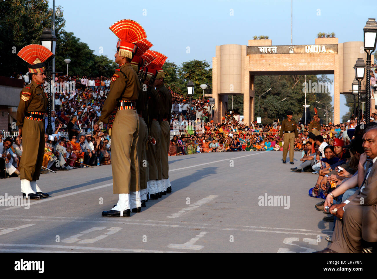 Indian Border Security Force soldiers during retreat ceremony called lowering flags Wagah border Punjab India - aum 162317 Stock Photo
