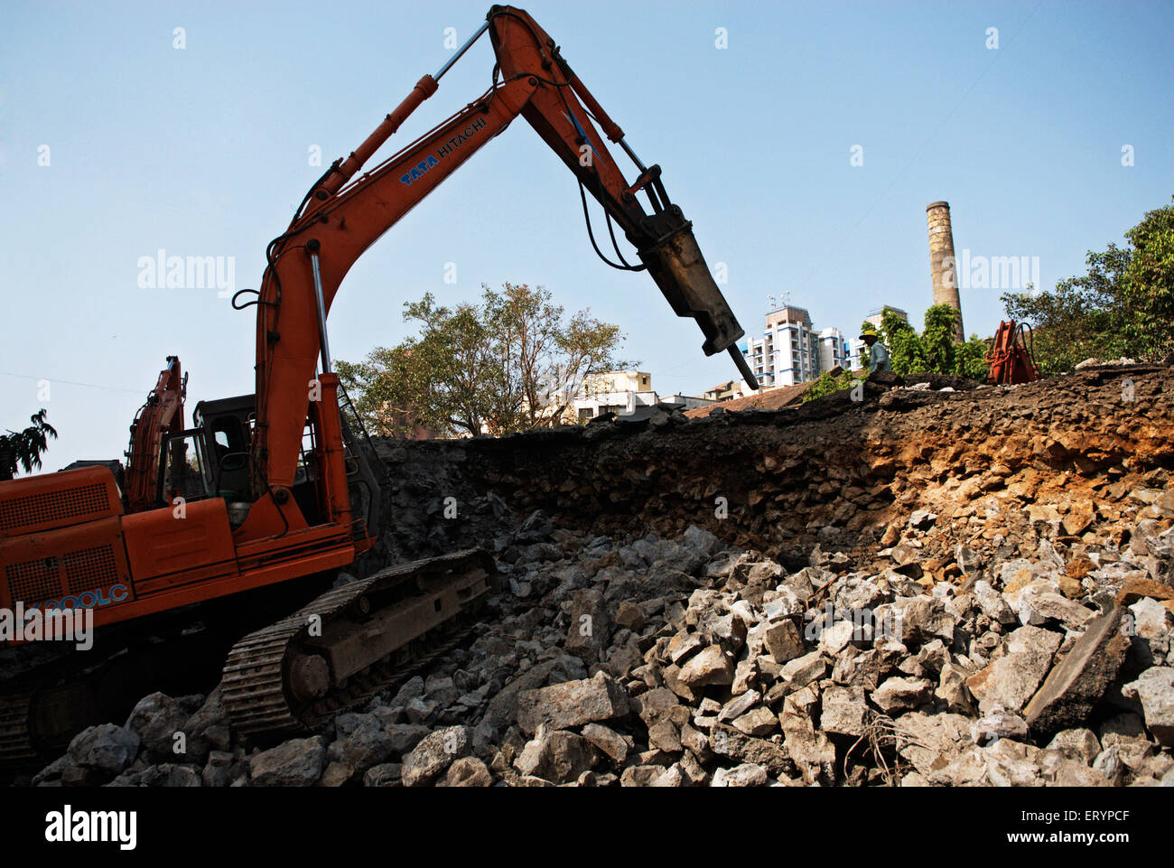 Excavator Machine drilling demolishing Lalbaug flyover , Parel , Bombay , Mumbai , Maharashtra , India , Asia Stock Photo