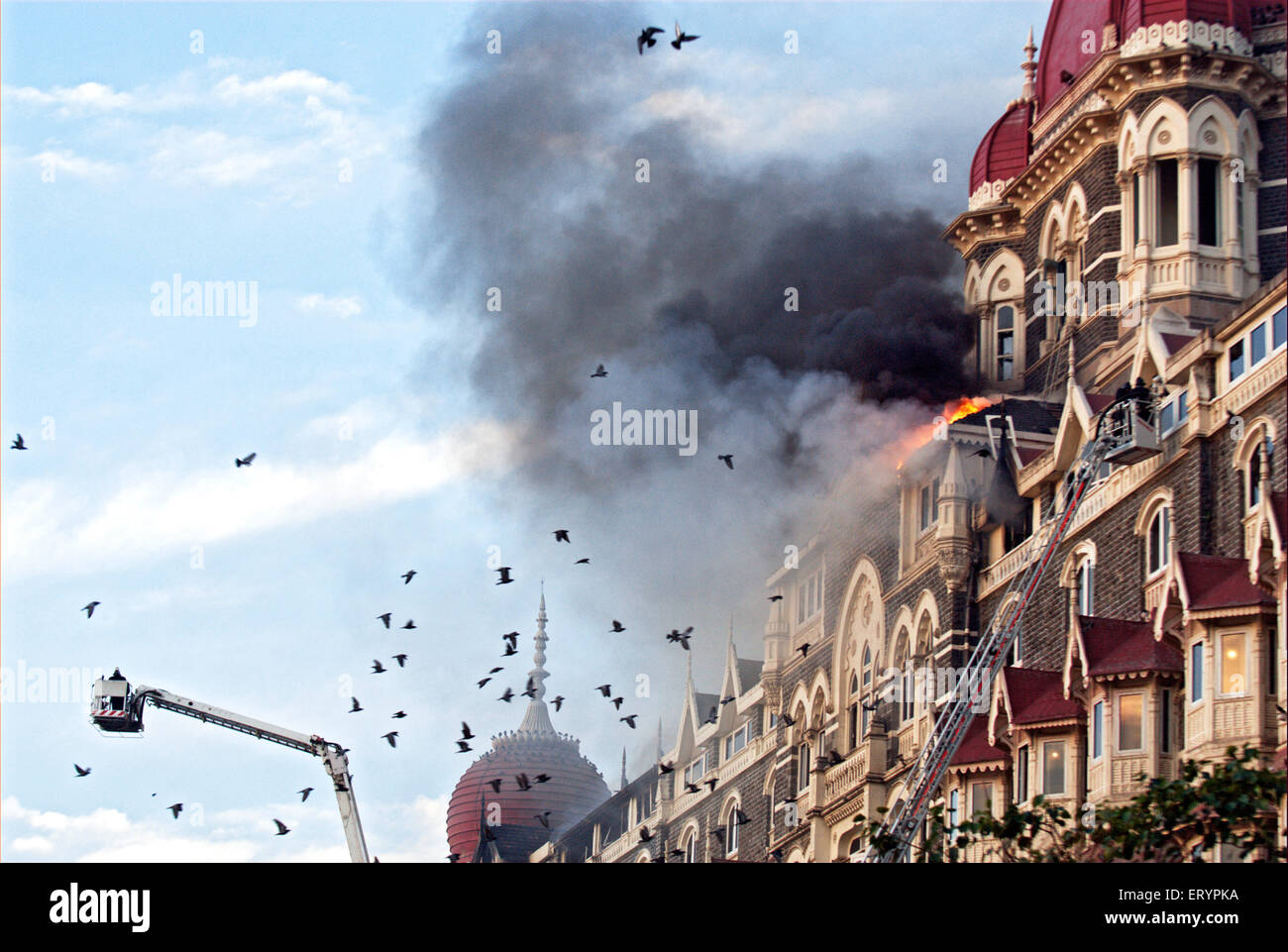 Fire fighters try to douse fire inside of Taj Mahal hotel after terrorist attack by deccan mujahedeen Bombay Stock Photo