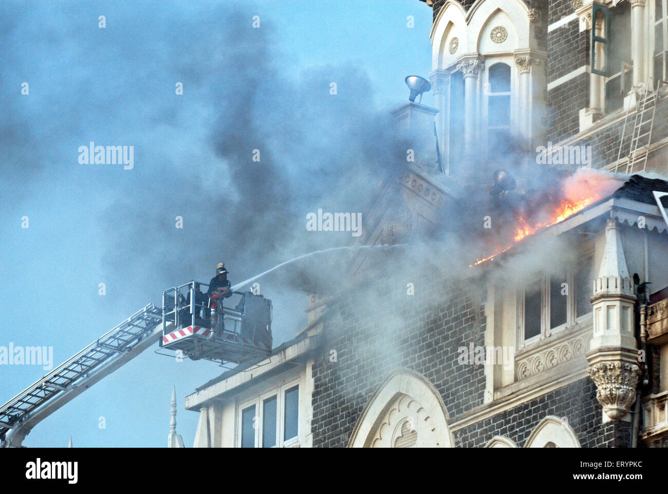 Fire fighters try to douse fire inside of Taj Mahal hotel after terrorist attack by deccan mujahedeen Bombay Stock Photo