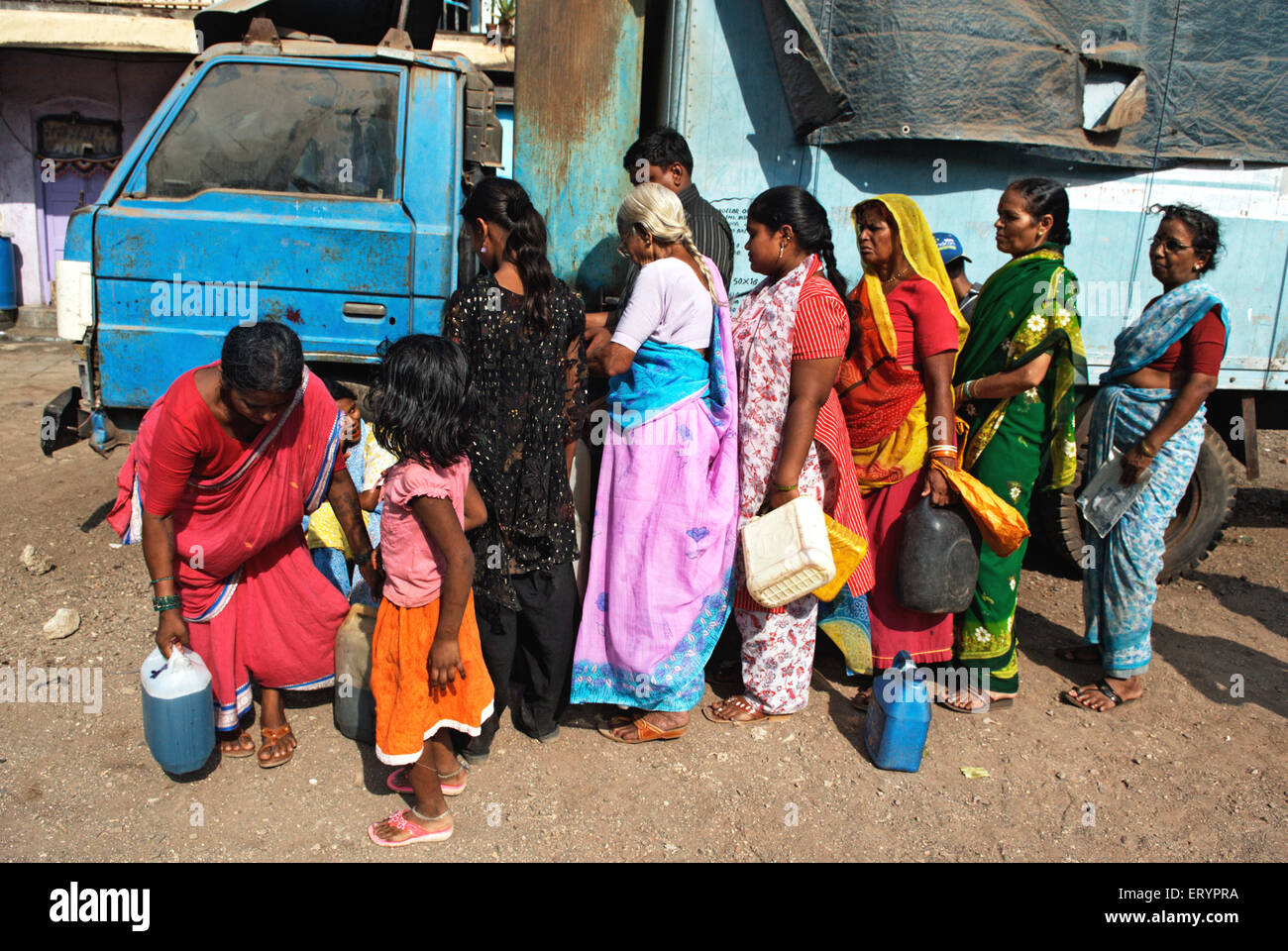 women in queue to collect kerosene , paraffin , lamp oil , Bombay , Mumbai  ; Maharashtra  ; India , asia Stock Photo