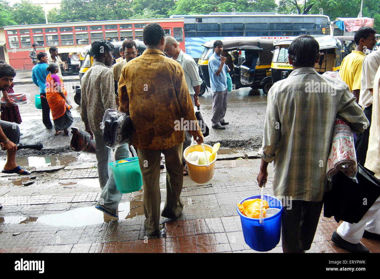 Poor people with relief materials, buckets, mats, food packets, Ghatkopar ; Bombay , Mumbai ; Maharashtra ; India , asia Stock Photo