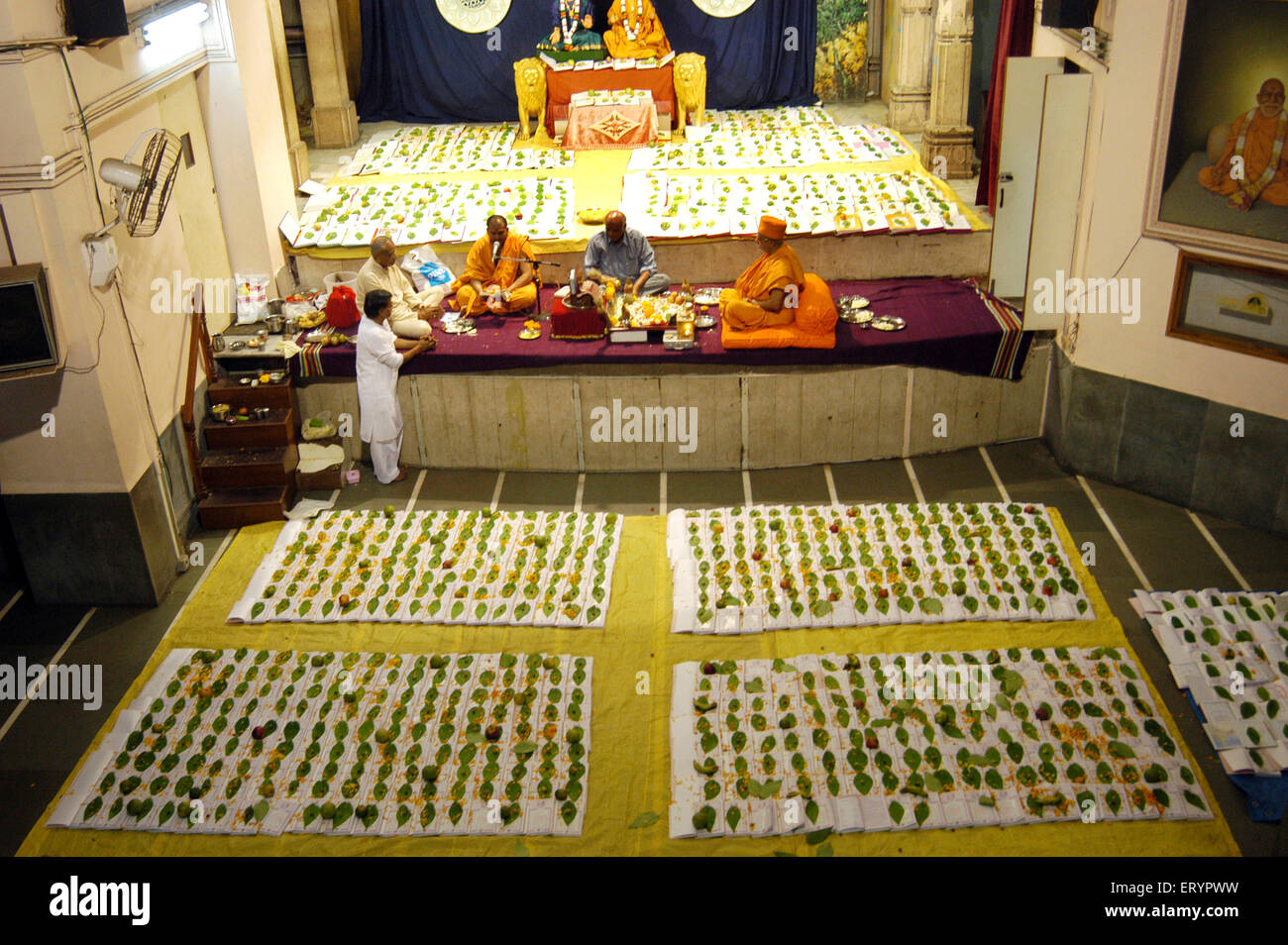 Chopda Lakshmi Puja , Swaminarayan priest performing Chopda Lakshmi Poojan , Diwali Festival , Bombay , Mumbai , Maharashtra , India , Asia Stock Photo