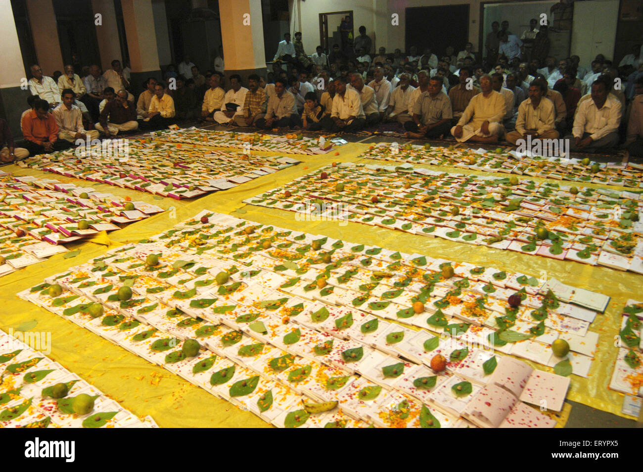 Chopda Lakshmi Puja , Swaminarayan priest performing Chopda Lakshmi Poojan , Diwali Festival , Bombay , Mumbai , Maharashtra , India , Asia Stock Photo