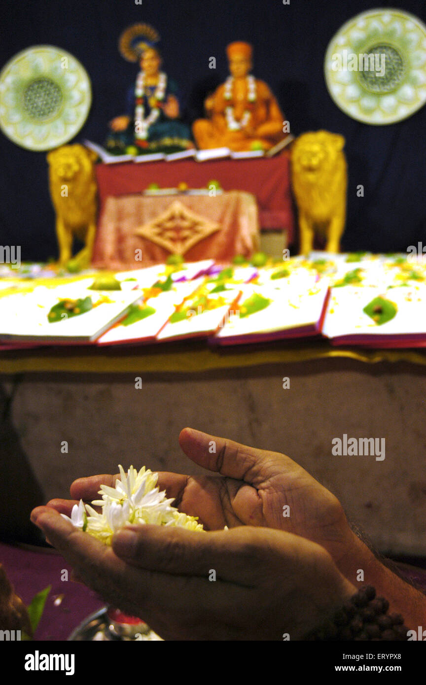 Chopda Lakshmi Puja , Swaminarayan priest performing Chopda Lakshmi Poojan , Diwali Festival , Bombay , Mumbai , Maharashtra , India , Asia Stock Photo