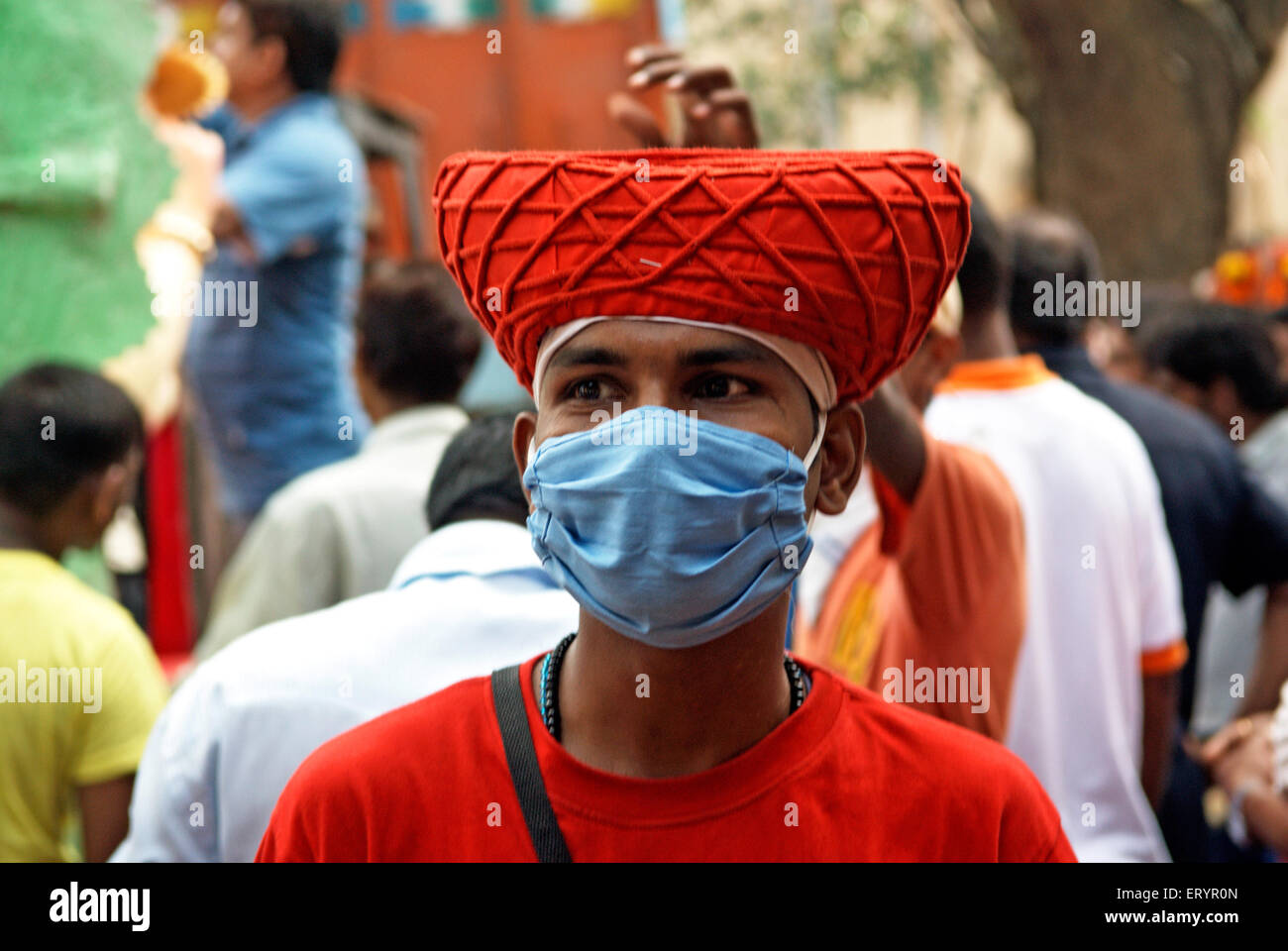 Man in Maratha cap and protective mask for virus protection ; Bombay ; Mumbai ; Maharashtra ; India ; Asia Stock Photo