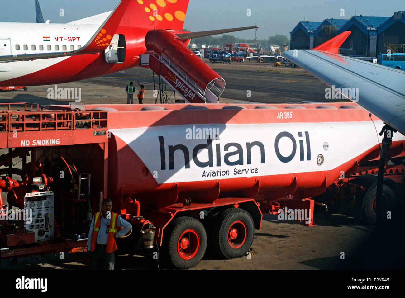 Indian oil aviation fuel tanker refueling SpiceJet aeroplane , Delhi , India , Asia Stock Photo