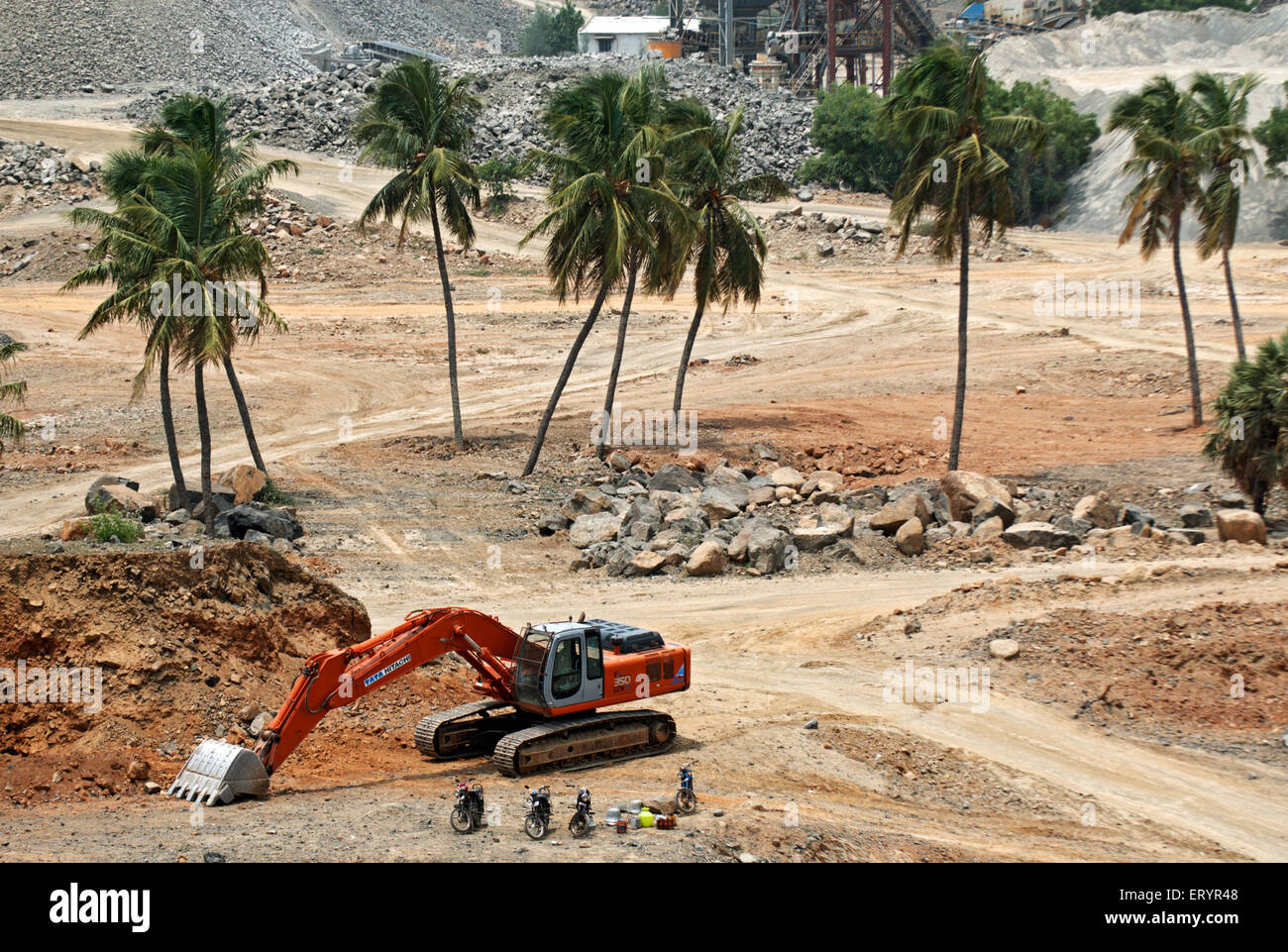 Hydraulic excavator at stone crushing plant , Madras , Chennai ; Tamil Nadu ; India , Asia Stock Photo
