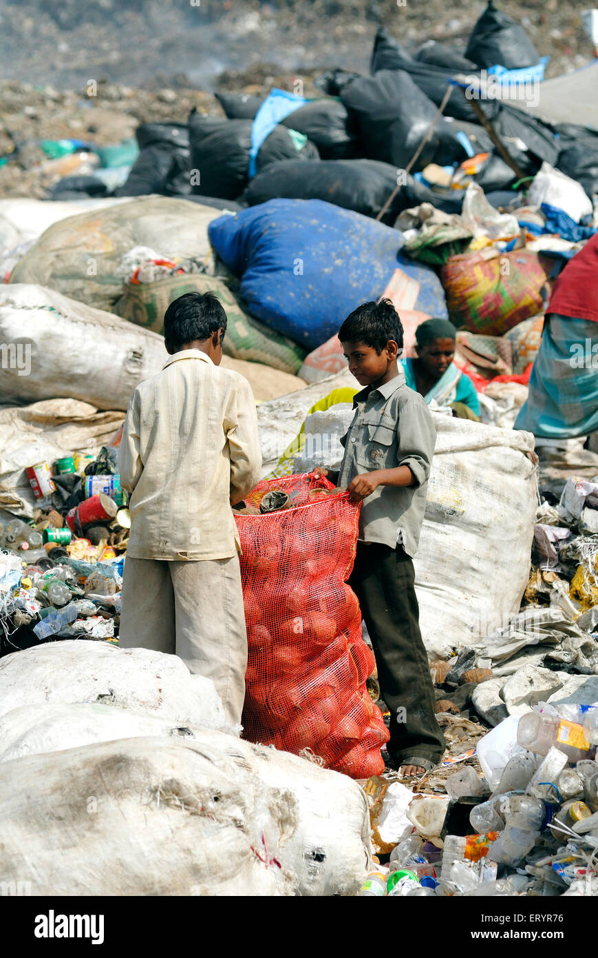 Rag picker collecting garbage , Landfill , waste dumping ground , Deonar , Bombay , Mumbai , Maharashtra , India , Asia Stock Photo