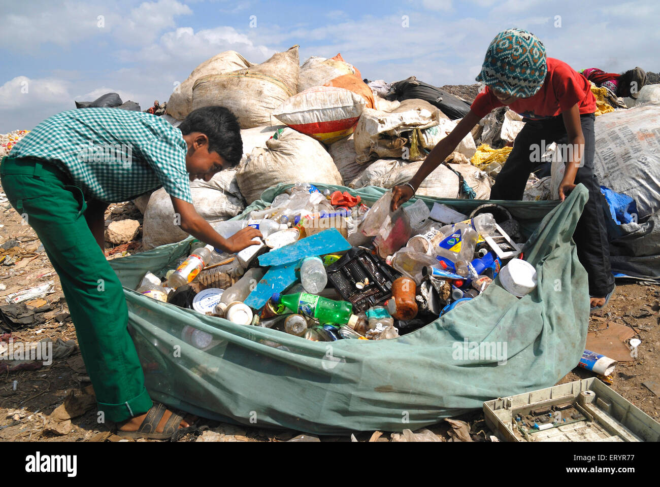 Rag pickers collecting garbage in dumping ground Deonar Bombay Mumbai Maharashtra India - asb 163523 Stock Photo