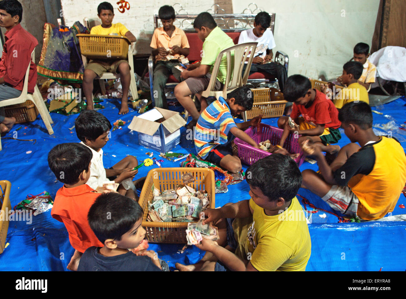 Devotees count cash offering to lalbaug cha raja after ganpati festival ; Bombay Mumbai ; Maharashtra Stock Photo