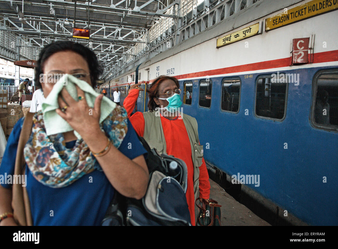 People covering face with mask handkerchief protection from virus , Bombay , Mumbai , Maharashtra , India , Asia Stock Photo