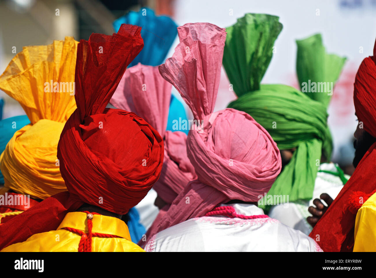 Sikh men in turbans in celebration of consecration of sikh guru granth sahib ; Nanded ; Maharashtra ; India Stock Photo