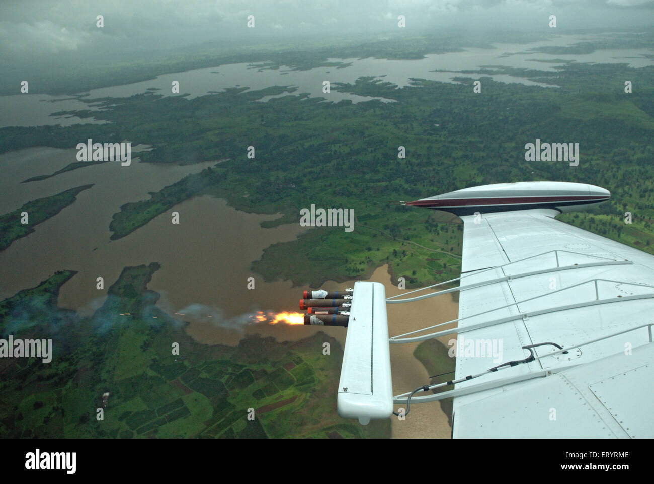 Cloud seeding by piper aircraft at upper vaitarana lake Nashik Maharashtra India Stock Photo