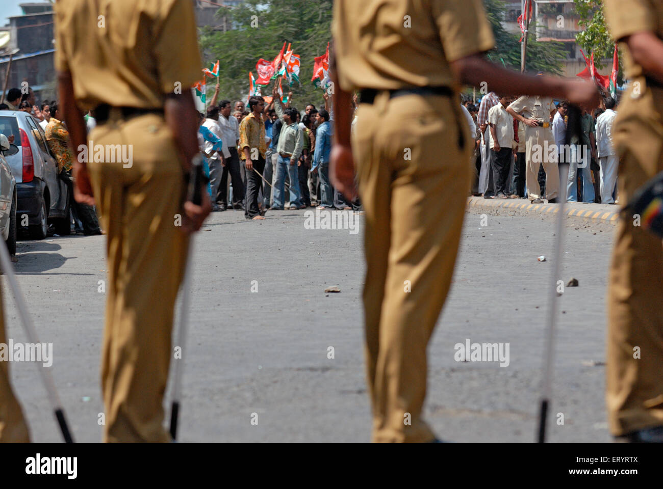 Police watching activist of maharashtra navnirman sena mns protesting ; Bandra ; Bombay Mumbai Stock Photo