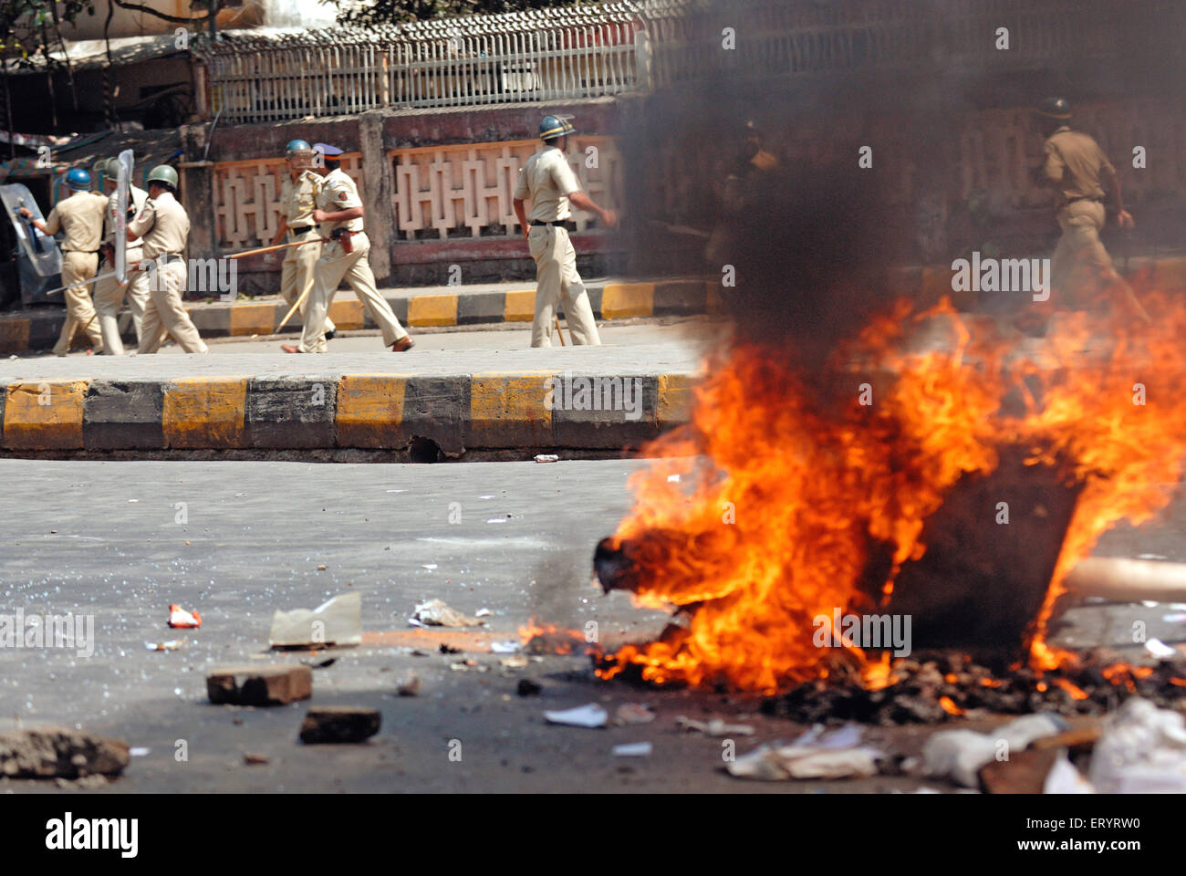 Burning garbage on road ; violent protest , Bandra ; Bombay , Mumbai ; Maharashtra ; India , Asia Stock Photo