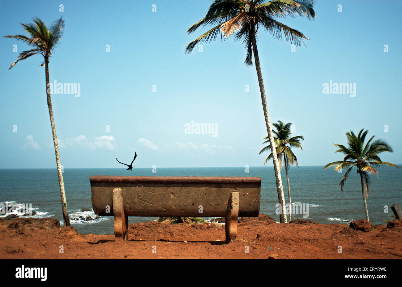 Empty bench facing sea at vagator beach ; Goa ; India 8 May 2008 Stock Photo