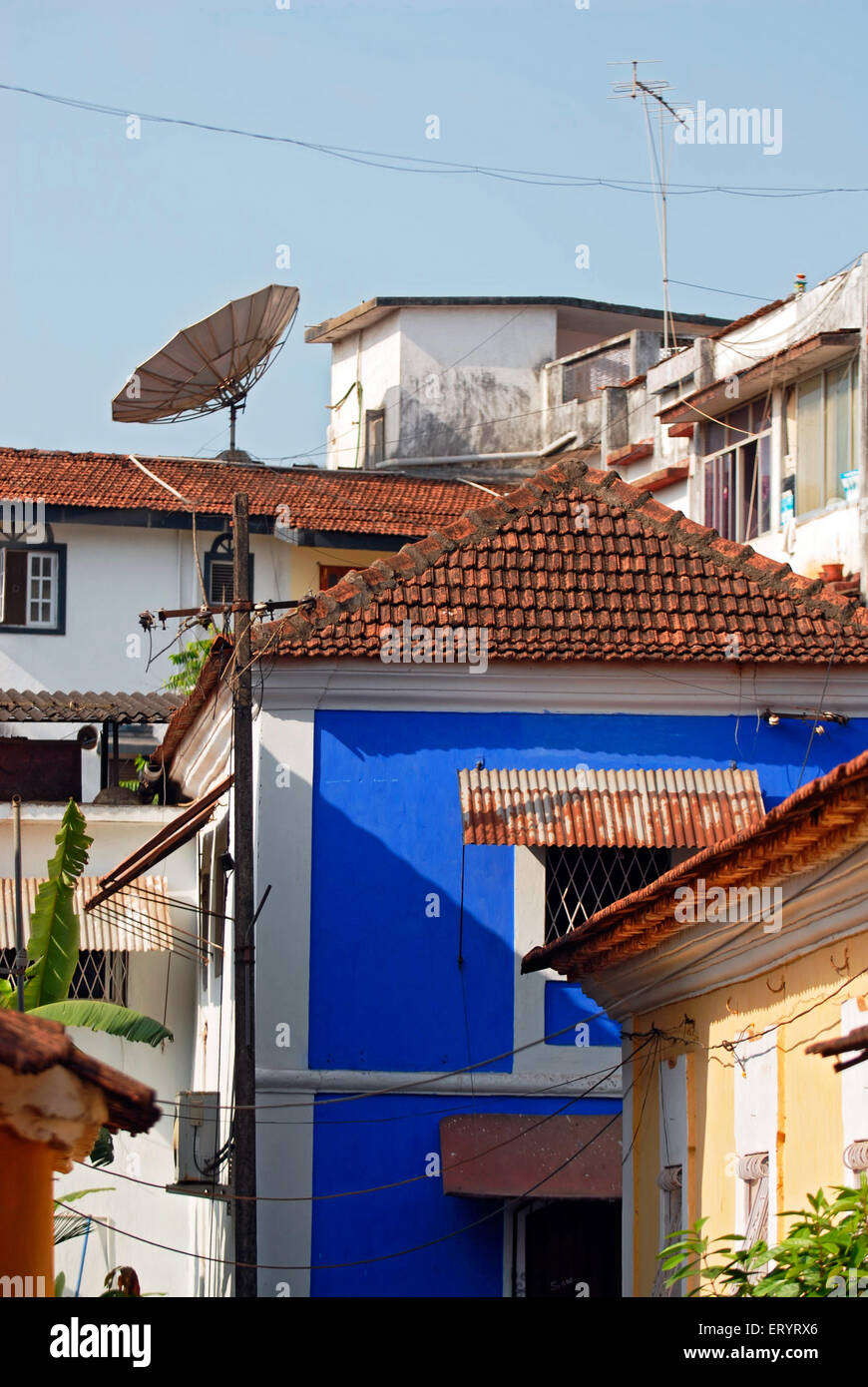 TV dish antenna on roof top of traditional houses ; Altinho ; Panjim , Panaji ; Goa ; India , Asia Stock Photo