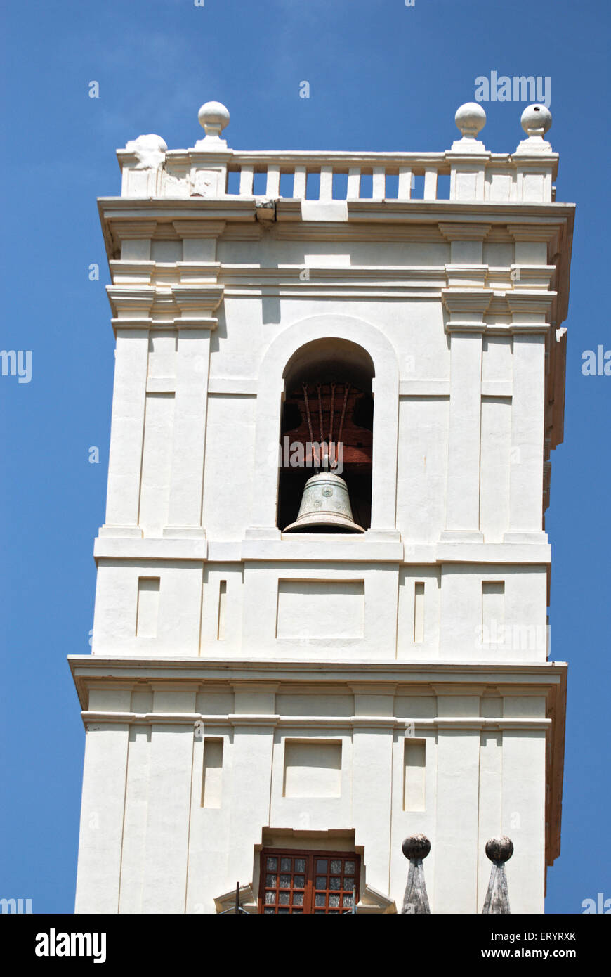 Huge bell hanging on minaret at se cathedral ; Old Goa ; Velha Goa ; India 7 May 2008 Stock Photo