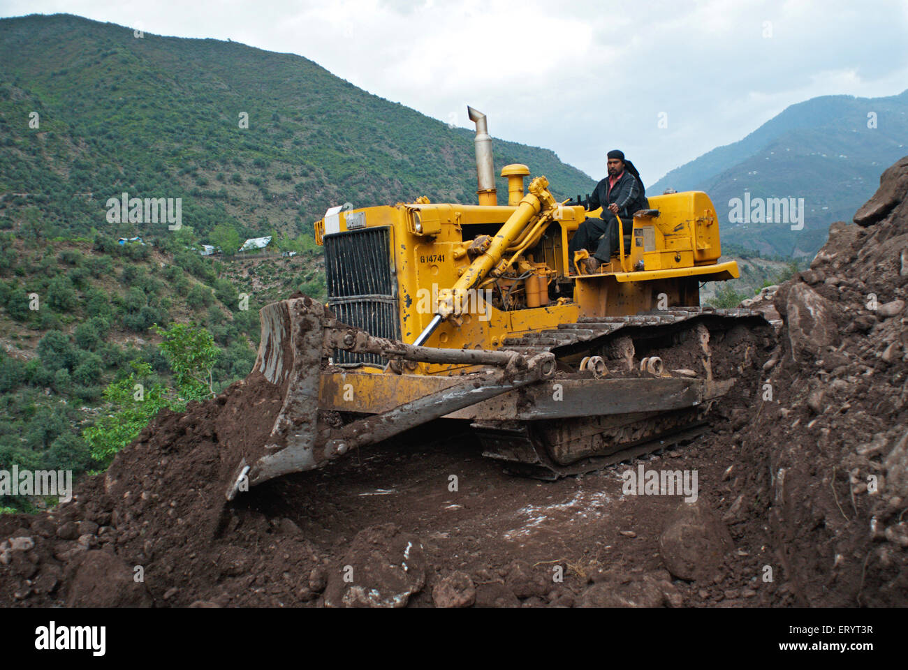 Road clearing machine , Dozer ; Urusa ; Kupwara , Muzaffarabad , Uri ; Jammu and Kashmir ; India , Asia Stock Photo