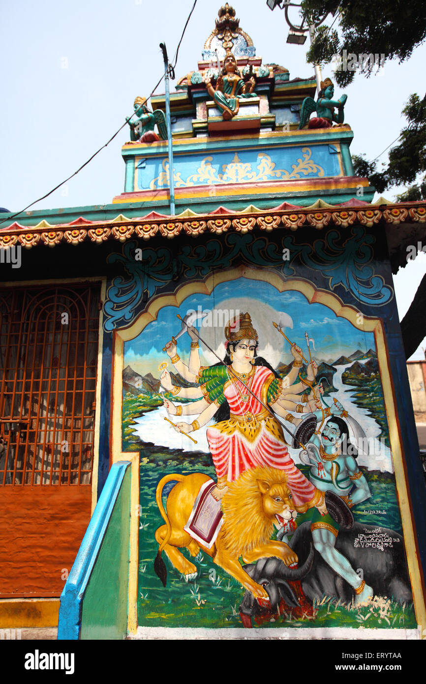 Painting of Goddess Durga sitting on lion and killing demon on temple wall ; Visakhapatnam