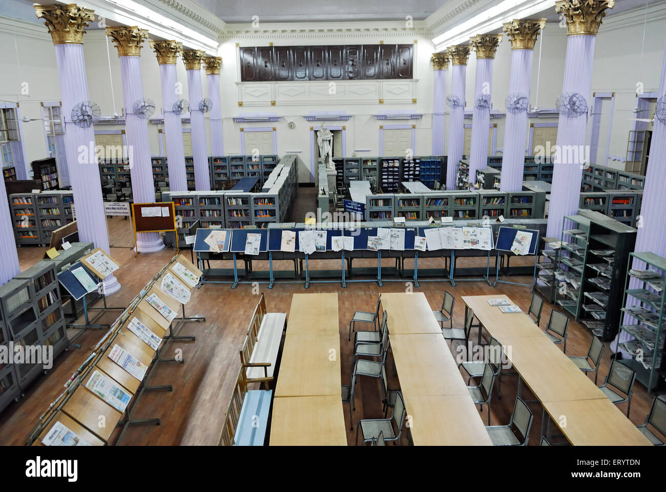 Newspaper stand and book shelves in town hall asiatic library Bombay
