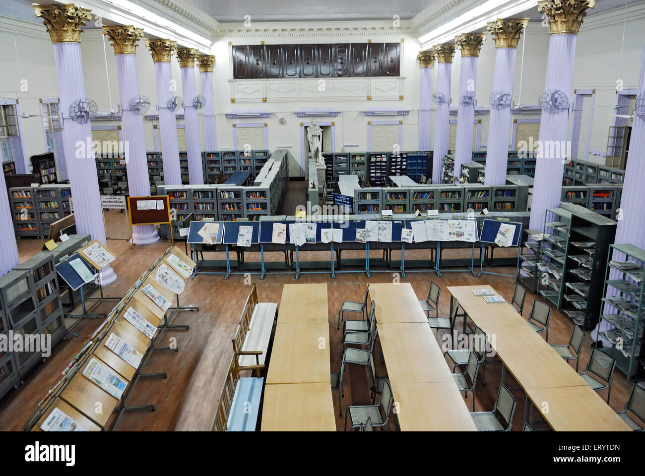 Newspaper stand and book shelves in town hall asiatic library Bombay Mumbai ; Maharashtra ; India Stock Photo
