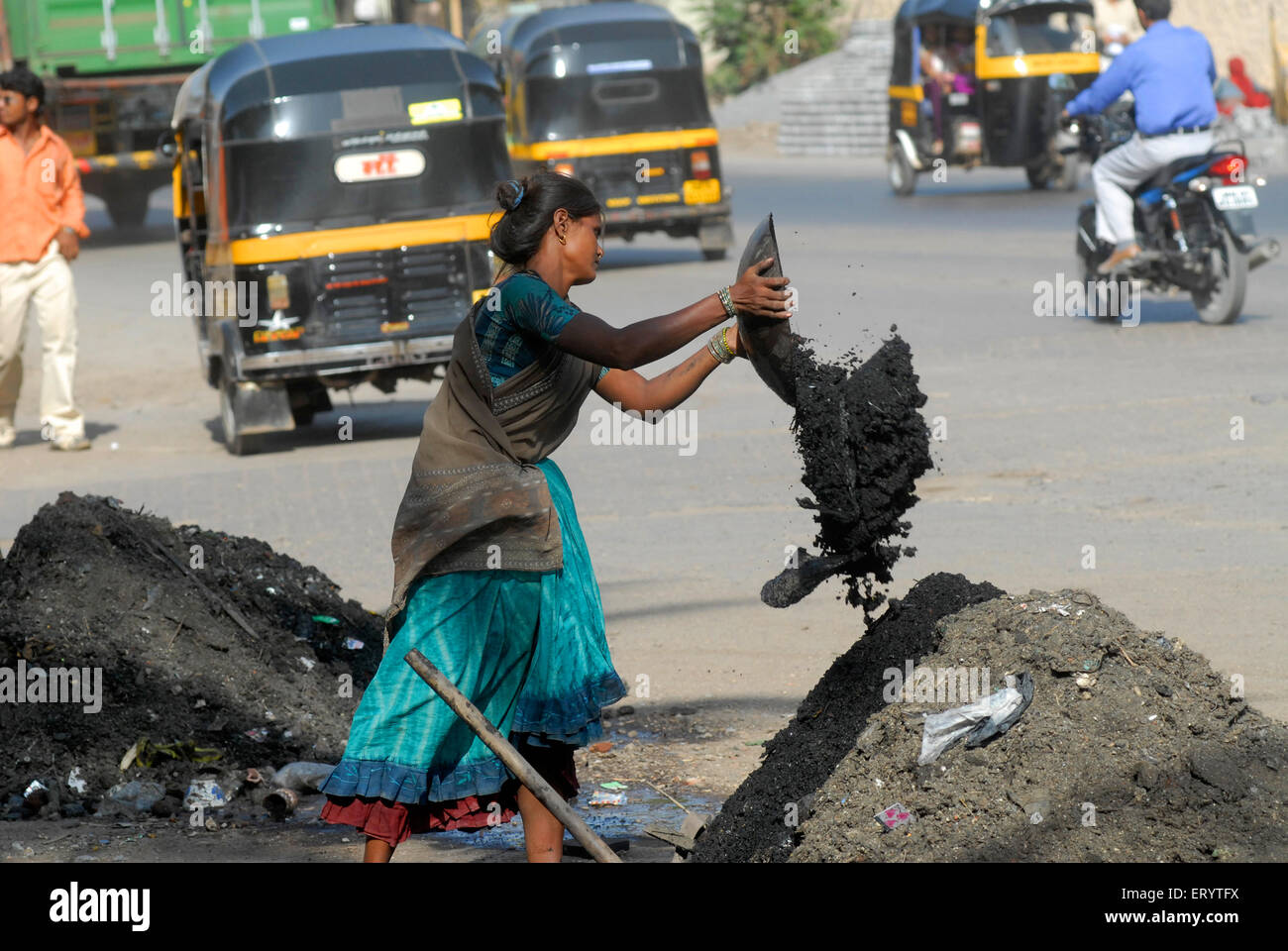 Women cleaning sewage drainage pipe , Bombay , Mumbai ; Maharashtra ; India , asia Stock Photo