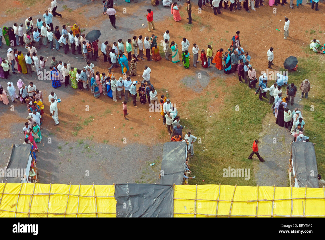 Voters standing in  queue to cast vote Bombay Mumbai ; Maharashtra ; India 13 10 2009 Stock Photo