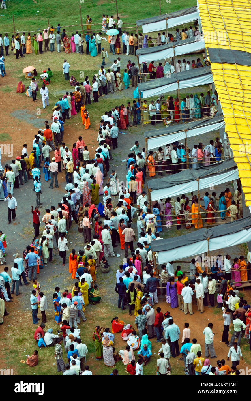 Voters standing in  queue to cast vote Bombay Mumbai ; Maharashtra ; India 13 10 2009 Stock Photo