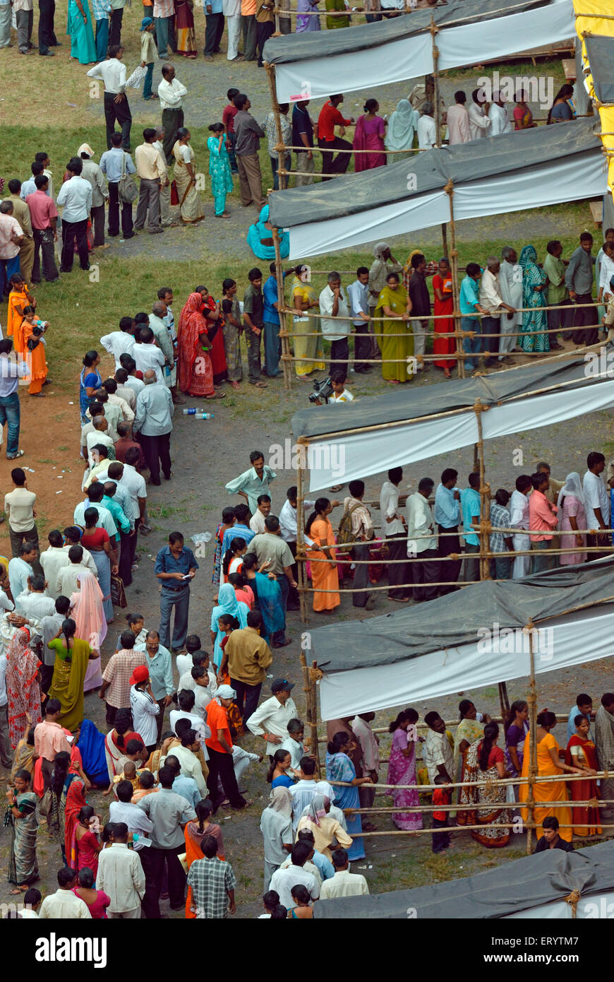 Voters standing in  queue to cast vote Bombay Mumbai ; Maharashtra ; India 13 10 2009 Stock Photo