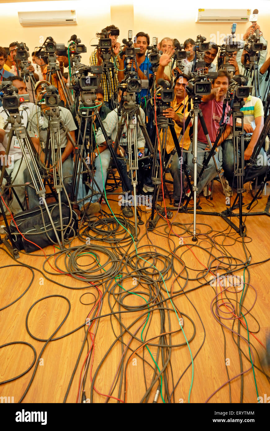 Press photographers and TV videographers cameraman at press conference at Indian elections , Bombay , Mumbai , Maharashtra , India , Asia Stock Photo