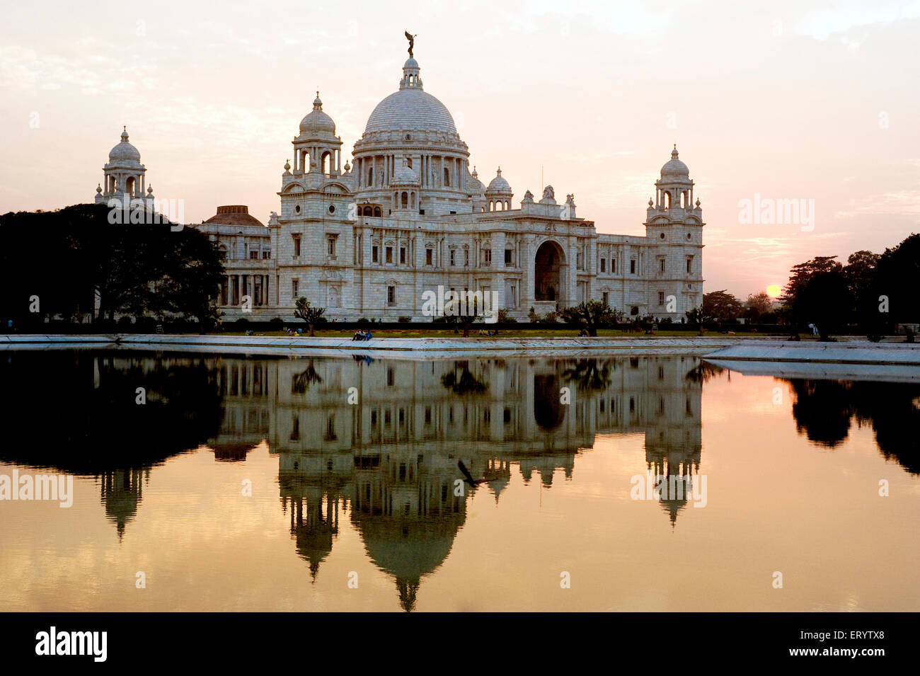 Victoria Memorial reflection in water at sunset ; Kolkata ; West Bengal ; India Stock Photo