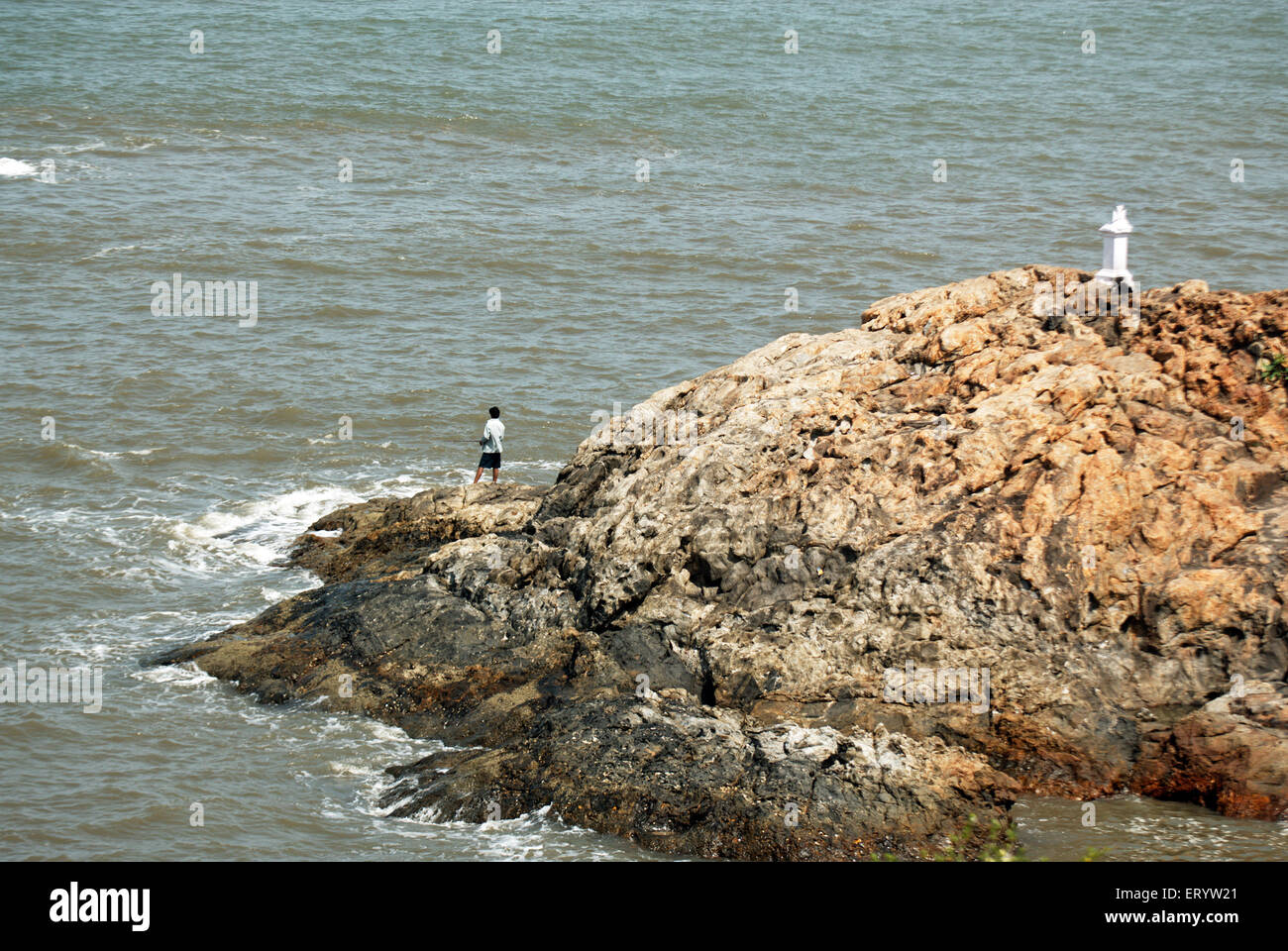 Men fishing at Vagator beach  ; Goa  ; India Stock Photo
