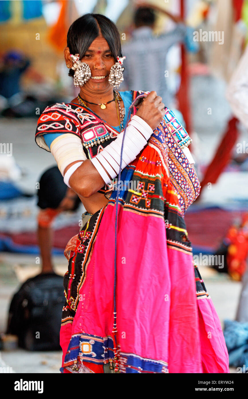 Gypsy tribal nomad tribe woman wearing bangles silver jewelry , Nanded , Marathwada , Maharashtra , India , Asia Stock Photo
