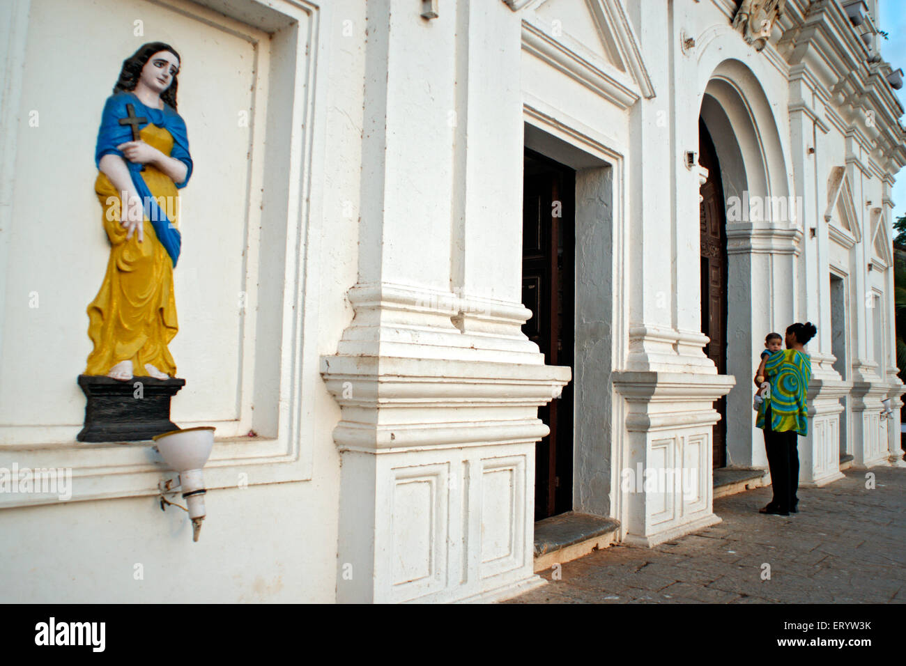 Devotee stand outside during mass at Church of Our lady Of Immaculate Conception  ; Panaji ; Panijm  ; Goa ; India NOMR Stock Photo