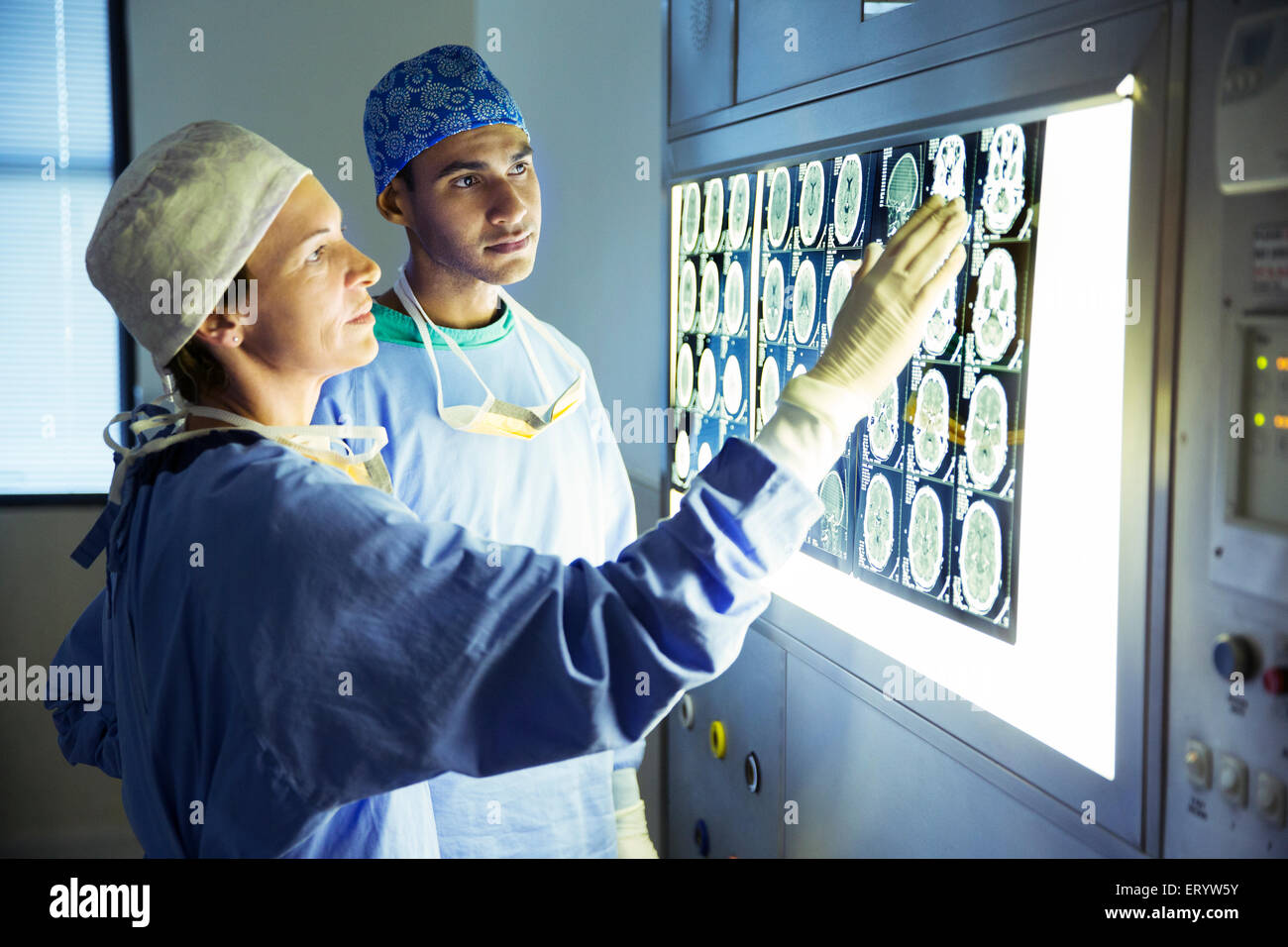 Surgeons discussing MRI scans Stock Photo